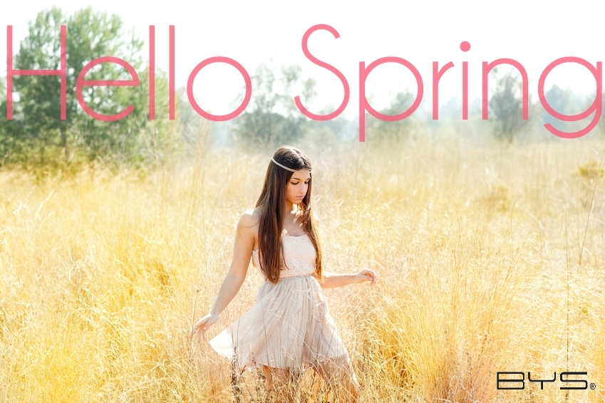 Asian indian woman walking in golden dried grass field